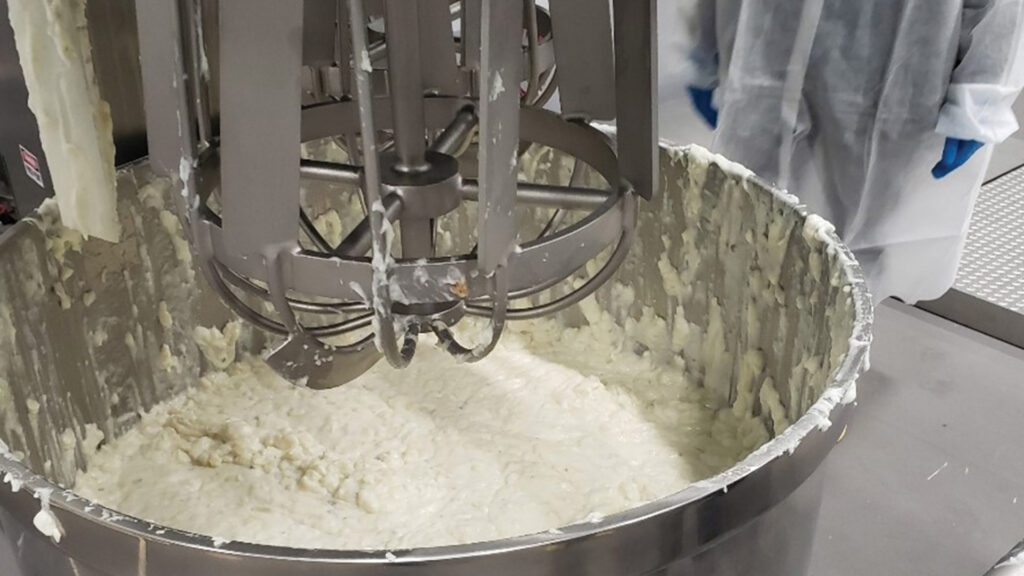 The T-750 Vertical Double Planetary Mixer in action, expertly mixing mashed potatoes